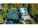 Overhead view of tennis courts and swimming pool within the community at 5306 Manorwood Dr # 2A, Sarasota, FL 34235