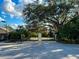 Gated community entrance with paved road and landscaping at 5306 Manorwood Dr # 2A, Sarasota, FL 34235