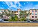 Grand Oak building exterior showcasing its architectural style and landscaping at 5306 Manorwood Dr # 2A, Sarasota, FL 34235