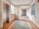 Building hallway with tile flooring, elevator access, and large windows at 5306 Manorwood Dr # 2A, Sarasota, FL 34235