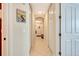 Bright hallway with tile flooring and access to multiple rooms at 5306 Manorwood Dr # 2A, Sarasota, FL 34235