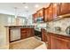Kitchen with granite countertops, stainless steel appliances, and wood cabinets at 5306 Manorwood Dr # 2A, Sarasota, FL 34235