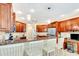 Kitchen with granite countertops and cherry wood cabinets at 5306 Manorwood Dr # 2A, Sarasota, FL 34235