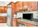 Kitchen desk with granite countertop and stainless steel appliances at 5306 Manorwood Dr # 2A, Sarasota, FL 34235