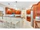 Kitchen with granite countertops and cherry wood cabinets at 5306 Manorwood Dr # 2A, Sarasota, FL 34235