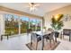 Spacious screened balcony with seating and nature views at 5306 Manorwood Dr # 2A, Sarasota, FL 34235