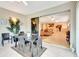 Screened balcony with view of living room and nature at 5306 Manorwood Dr # 2A, Sarasota, FL 34235
