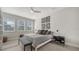 Serene bedroom with large bed and built-in shelves at 5433 Hope Sound Cir, Sarasota, FL 34238
