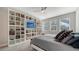 Cozy bedroom with built-in shelves and TV at 5433 Hope Sound Cir, Sarasota, FL 34238