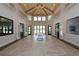 Spacious clubhouse with high ceilings, wood beams, and large windows overlooking the outdoor pool at 5433 Hope Sound Cir, Sarasota, FL 34238