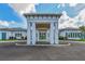 Modern community entrance with white columns and teal accents at 5433 Hope Sound Cir, Sarasota, FL 34238