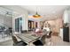 Bright dining area with table and chairs, view to patio at 5433 Hope Sound Cir, Sarasota, FL 34238