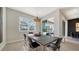 Modern dining room with sleek table and access to the backyard at 5433 Hope Sound Cir, Sarasota, FL 34238