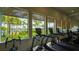 Fitness center with treadmills and other equipment with pool view at 5433 Hope Sound Cir, Sarasota, FL 34238