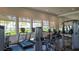 Modern fitness center with various equipment and natural light at 5433 Hope Sound Cir, Sarasota, FL 34238
