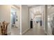 Hallway featuring tile floors and access to the bathroom and other living spaces at 5433 Hope Sound Cir, Sarasota, FL 34238