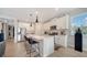 Modern kitchen boasts white cabinets and stainless steel appliances at 5433 Hope Sound Cir, Sarasota, FL 34238