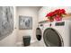 Laundry room with washer, dryer, and extra storage at 5433 Hope Sound Cir, Sarasota, FL 34238