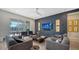Relaxing living room with dark walls, large TV, and modern furniture at 5433 Hope Sound Cir, Sarasota, FL 34238