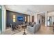 Spacious living area with dark-gray accent wall and comfy seating at 5433 Hope Sound Cir, Sarasota, FL 34238