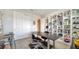 Spacious home office with a large desk and bookshelves at 5433 Hope Sound Cir, Sarasota, FL 34238