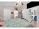 Bright bedroom with a view of the backyard and access to a bathroom at 585 Purdy St, Englewood, FL 34223