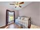 Light-filled bedroom with a daybed and window seat at 585 Purdy St, Englewood, FL 34223