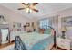 Charming bedroom with a floral bedspread and ensuite bathroom access at 585 Purdy St, Englewood, FL 34223