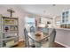 Charming dining area with a rustic table and shelving at 585 Purdy St, Englewood, FL 34223
