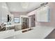 Modern kitchen with white cabinets, stainless steel appliances, and a breakfast bar at 585 Purdy St, Englewood, FL 34223