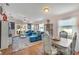 Bright living room with hardwood floors, comfy seating, and a dining area at 585 Purdy St, Englewood, FL 34223