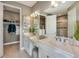 Double vanity bathroom with a walk-in shower and separate closet at 6005 Mesa Gln, Bradenton, FL 34203