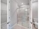 Modern bathroom showcasing glass shower, toilet and walk-in closet at 6005 Mesa Gln, Bradenton, FL 34203