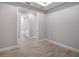 Neutral walls and wood floors provide a bright, neutral aesthetic for this room at 6005 Mesa Gln, Bradenton, FL 34203