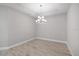 Cozy bedroom with gray walls and wood-look tile flooring; perfect for relaxation at 6005 Mesa Gln, Bradenton, FL 34203