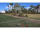 Bocce ball court with manicured landscaping and palm trees create an inviting outdoor experience at 6005 Mesa Gln, Bradenton, FL 34203