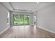 The living room has access to the outside through sliding glass doors at 6005 Mesa Gln, Bradenton, FL 34203