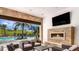 Relaxing outdoor patio with fireplace and pool views at 6005 Mesa Gln, Bradenton, FL 34203
