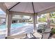 Relaxing poolside cabana overlooking the resort-style pool and lush landscaping, offering a serene escape at 6005 Mesa Gln, Bradenton, FL 34203