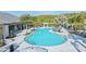 Beautiful resort-style pool surrounded by lounge chairs and cabanas, perfect for relaxation and outdoor enjoyment at 6005 Mesa Gln, Bradenton, FL 34203