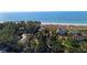 Aerial view showcasing home's location near the beach at 6061 Gulf Of Mexico Dr, Longboat Key, FL 34228