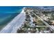 Panoramic aerial view of beachfront homes with lush tropical landscaping at 6061 Gulf Of Mexico Dr, Longboat Key, FL 34228
