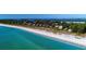 Beachfront homes and lush tropical landscape along the coast at 6061 Gulf Of Mexico Dr, Longboat Key, FL 34228