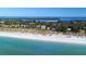 An aerial perspective captures the property's proximity to the shoreline, showcasing both the house and the beach at 6061 Gulf Of Mexico Dr, Longboat Key, FL 34228