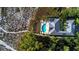 Aerial view of a luxury home with a pool near the beach at 6061 Gulf Of Mexico Dr, Longboat Key, FL 34228