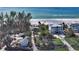 Aerial view of luxury home near beautiful white sand beach at 6061 Gulf Of Mexico Dr, Longboat Key, FL 34228