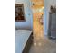 View into the bathroom with a vanity, tile flooring, and natural light at 6061 Gulf Of Mexico Dr, Longboat Key, FL 34228