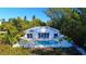 Beautifully landscaped home with a sparkling pool and lush tropical surroundings at 6061 Gulf Of Mexico Dr, Longboat Key, FL 34228