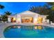 Charming home with a private pool and a well-manicured backyard oasis at 6061 Gulf Of Mexico Dr, Longboat Key, FL 34228