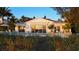 White beach house with pool and patio, offering sunset views at 6061 Gulf Of Mexico Dr, Longboat Key, FL 34228